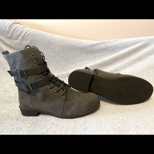Grey combat style boot with buckle detail